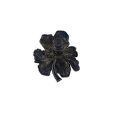 Navy blue iris-shaped brooch by BEGÜM KHAN featuring intricate metalwork and elegant design.