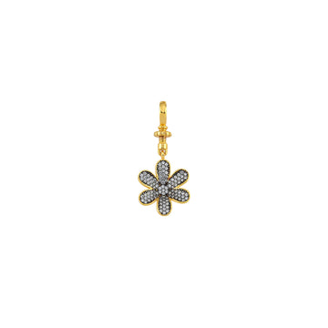 Small gold mini daisy charm by BEGÜM KHAN, featuring delicate petal details and a loop for jewelry attachment.