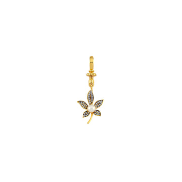 Close-up of BEGÜM KHAN MINI MARI CHARM, a small, detailed jewelry charm with colorful design and intricate craftsmanship.