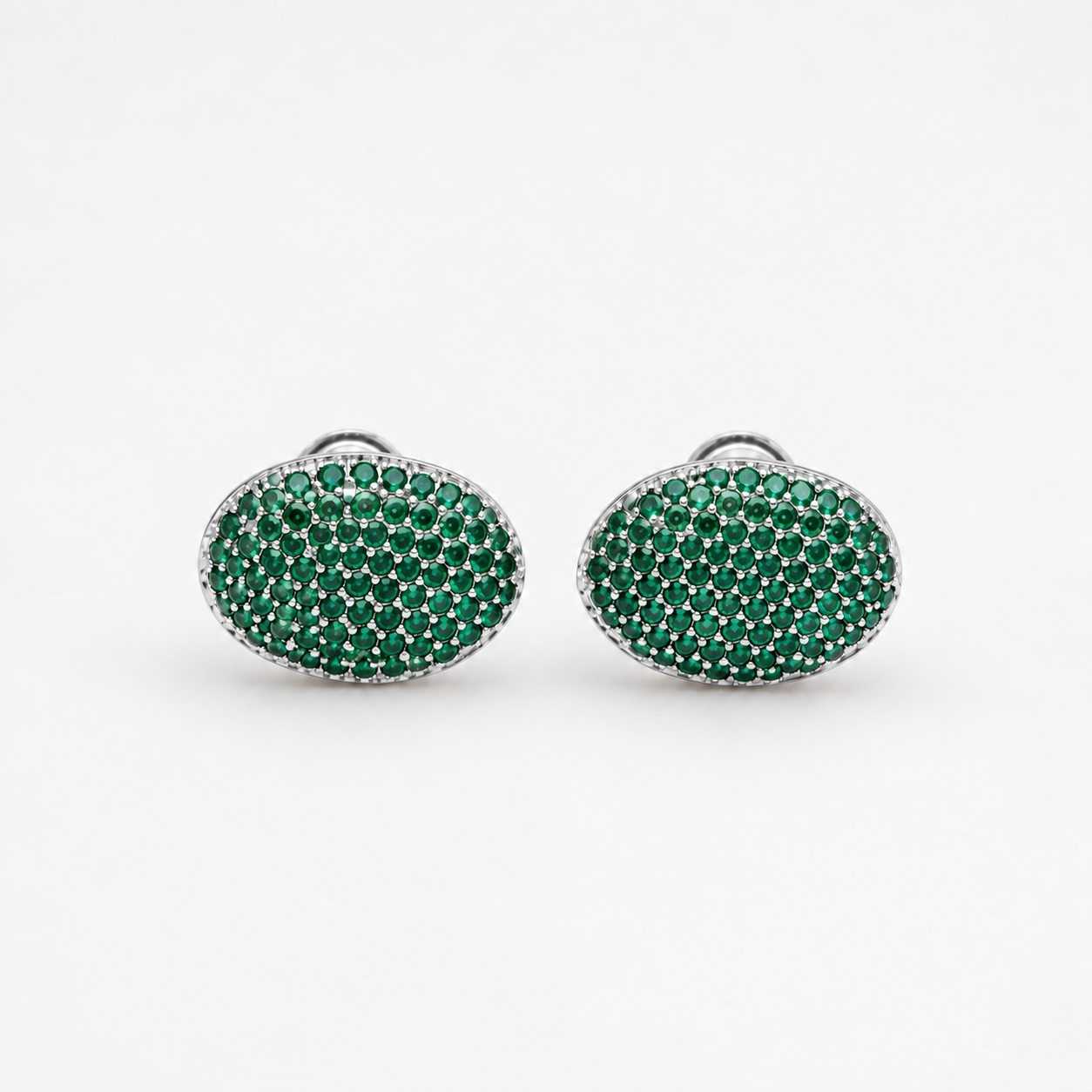 Platinum and green gemstone cufflinks from BEGÜM KHAN's MAGIC BEANS Archive collection, featuring elegant, polished design.