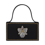 Gold orchid-themed BEGÜM KHAN bag with floral design, featuring a structured shape and elegant details.